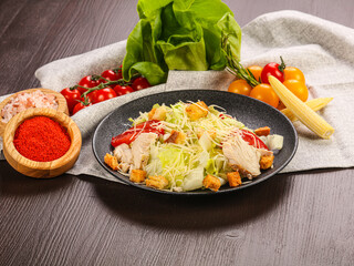 Caesar salad with chicken and cheese