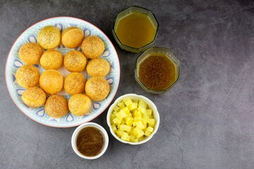 Indian traditional snack. Flat lay Pani puri with boiled potato and sauce.