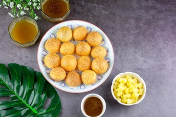 Indian traditional snack. Flat lay Pani puri with boiled potato and sauce.