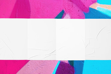 Closeup of colorful blue pink magenta painted urban wall texture with four wrinkled glued poster templates. Modern mockup for design presentation. Creative urban city background. 