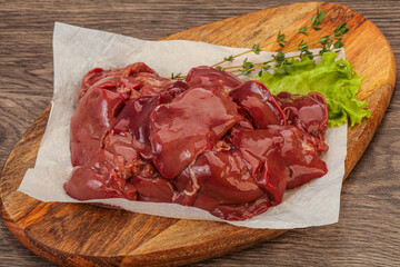 Raw chicken liver over board