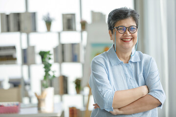 Cheerful Asian artist at home