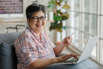 Mature female customer making online order