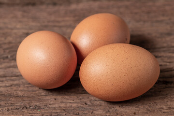 three fresh egg on wood table