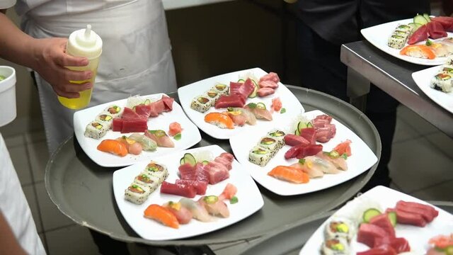 Sushi master preparing tuna otoro, chutoro and red meat in Japanese restaurant