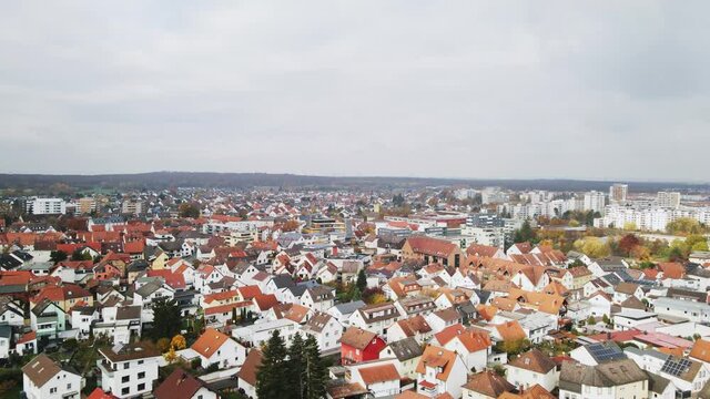 Aerial. Small German town, houses with red tile roofs in Dietzenbach. Overcast day