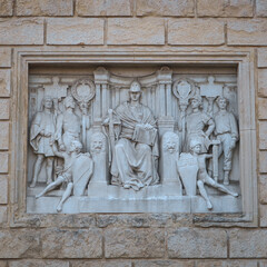 Bas-reliefs at the entrance to the "Montagnola Park" in the city of Bologna, Italy
