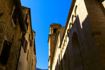 Fototapeta na wymiar Old narrow street with church in old town of Kotor Montenegro . Medieval architecture in Balkans 