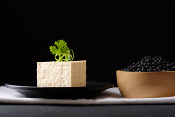 Fresh tofu made from organic soybeans is an ingredient in plant based as a healthy and vegetarian food.