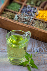 Lemon verbena leaves and verbena tea. Aloysia citrodora. spice rack wooden backgroune