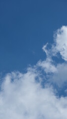 View of beautiful blue sky background with white clouds at the noon, Bangkok, Thailand.