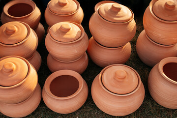 Clay crockery photo. European traditional clay pots used for preparing and serving food. Pattern background. Close up.