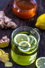 Ginger lemon honey infusion wooden background