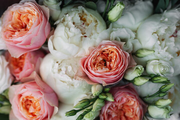 Wedding bouquet of delicate color close-up. White and pink roses.