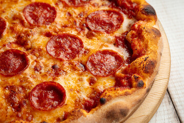 Closeup on fresh baked pepperoni pizza with salami