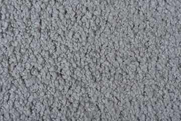 Carpet covering background. Pattern and texture of gray colour carpet. Copy space 