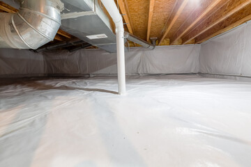 Crawl space fully encapsulated with thermoregulatory blankets and dimple board. Radon mitigation system pipes visible. Basement location for energy saving home improvement concept. - obrazy, fototapety, plakaty