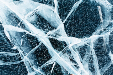 The icy surface of a frozen Lake Baikal. Line cracks. Natural background.