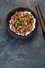Bulgogi with meat on dark background.
