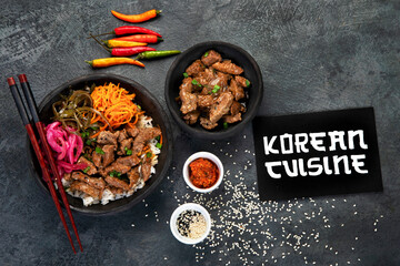 Bulgogi with meat on dark background.