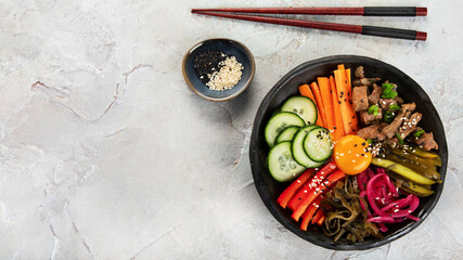 Bibimbap with snacks on gray background.