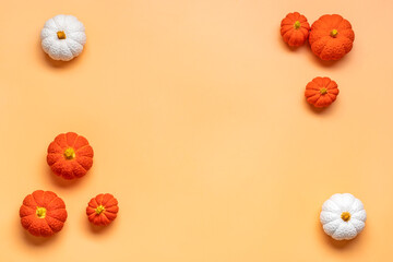 Orange, white, orange pumpkin isolated on beige background Top view Flat lay Hello autumn, happy thanksgiving concept Holiday card