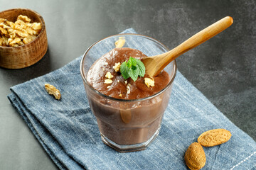 Chocolate pudding with mint and walnuts
