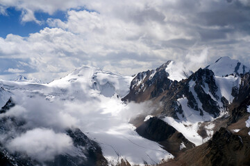 Fototapeta na wymiar Snowy mountains and glacier, top view.