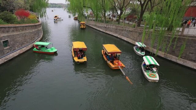 Cruise ships travel in Beihai Park, Beijing