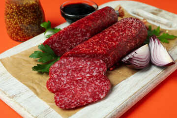 Сoncept of tasty food with salami sausage, close up