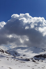Fototapeta na wymiar Snow mountains and blue sky with cloud