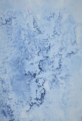 Blue watercolor background. Transparent lines and spots. Paint leaks and ombre effects. Abstract hand-painted image.