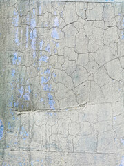 Fototapeta na wymiar texture of old metal garage wall exposed to weather conditions with cracked white paint