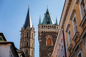 Fototapeta premium Kolin, Central Bohemia, Czech republic, 10 July 2021: Medieval stone St. Bartholomew´s Church with tower in sunny summer day, arched windows, chimeras and gargoyles, Gothic Cathedral with belfry