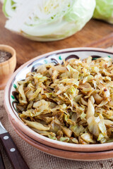 Fried white cabbage with caraway seeds and curry powder