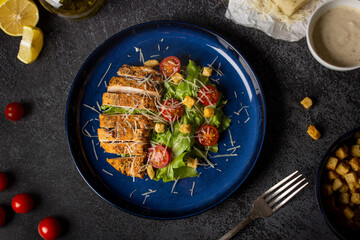 Fried chicken with satad like Caesar. Top View.