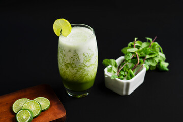 Honey dew juice or melon juices on black background. 