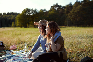 Female friends having picnic together