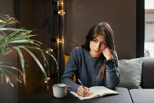 Thoughtful woman looking away