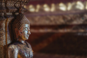 Close up of golden Buddha statue in a temple