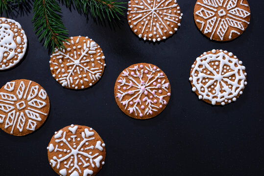 Christmas cookies with icing on black background