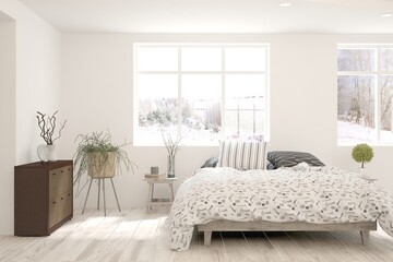 Fototapeta premium Stylish bedroom in white color with winter landscape in window. Scandinavian interior design. 3D illustration