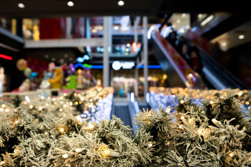 Christmas lights and pine branches decoration in shopping mall