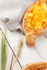 Traditional Georgian bread khachapuri on the table Homemade baking