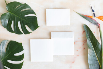 Styled summer wedding desktop stationery mockup. Blank greeting and invitation card. Green tropical...