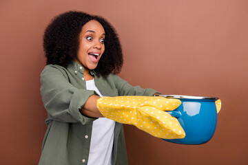 Profile photo of funky brunette young lady cook meal give empty space wear khaki shirt isolated on...