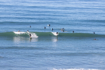 Fototapeta na wymiar Surfing at Swamis in San Diego