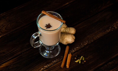 Traditional Indian drink chai masala. On an old rustic wooden table. High quality photo