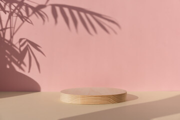 Premium podium with a shadow of tropical palm leaves on a pink wall. A cylindrical wooden scene on...