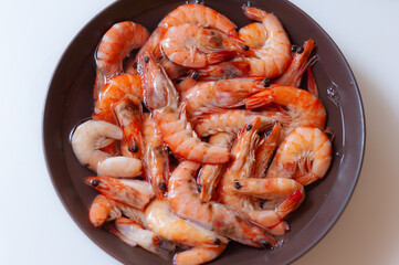 Frozen shrimp defrosted in a plate